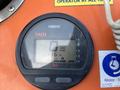 Close-up of a Yamaha tachometer displaying 0 RPM and 136 hours of operation on an orange panel of a 2007 Fassmer 20 Foot Fast Rescue Boat