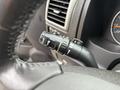 A close-up of the turn signal lever in a 2011 Chevrolet Colorado showing various control settings for lights and wipers