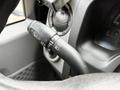 Close-up of the gear lever controls on the steering column of a 2017 Ford E450 featuring turn signal and wiper functions