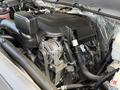 A 2016 Chevrolet Silverado 2500HD engine with visible components such as the alternator and various hoses and wires