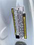 A close-up view of a label on the door frame of a 2016 RAM 5500 outlining vehicle specifications and instructions for the manufacturer