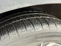 Close-up view of a tire from a 2023 Kia Niro EV showing detailed tread pattern and rubber texture
