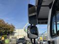 A close-up of the side mirrors on a 2022 Freightliner M2 106 truck showcasing their design and functionality
