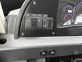 The control panel of a 2016 Grande West Vicinity featuring buttons for driver heater, windshield de-icer, mirror de-icer, dimmer switch and gauges for temperature and defrost