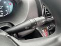 A close-up of a 2023 RAM Promaster 3500 control stalk featuring windshield wiper and washer icons on a black handle