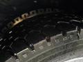 Close-up of a treaded tire from a 2015 Ford F-450 showing deep grooves for traction and a rugged surface design