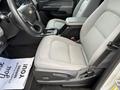 2018 Chevrolet Colorado interior showing the driver's seat and steering wheel with a gray fabric seat and console