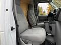 Interior of a 2022 Ford E-450 showing two gray cloth seats and a center console with cup holders