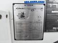 A metallic information plate detailing specifications and diagrams for a Terex XT Pro Series crane
