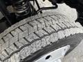 Close-up of a tire from a 2012 Ford F-550 showing detailed tread patterns and wear on the surface