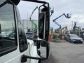 A 2012 International TerraStar truck with a prominent side mirror visible in the foreground