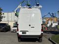 A 2024 Mercedes-Benz Sprinter 2500 van is parked with its back facing the viewer featuring a clean white exterior and no visible license plate