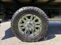 Close-up of a chrome wheel and tire from a 2019 Ford F-350 SD showcasing the Goodyear Wrangler tire tread and sturdy alloy rim