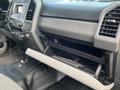 Interior view of a 2017 Ford F-250 SD showing the dashboard with controls and an open glove compartment