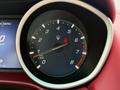 A close-up of the tachometer gauge in a 2016 Maserati Ghibli displaying engine RPM with a red indicator showing a horse emblem at the 6 mark