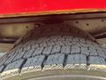 A close-up of a large tire from a 2007 GMC C4500 TopKick showing deep tread patterns designed for traction on various surfaces