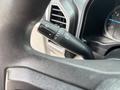 A close-up of the turn signal stalk inside a 2017 Ford F-150 showing various controls for headlights and turn signals
