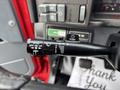Close-up of the windshield wiper control stalk in a 2002 GMC C7500 showing various settings including mist and delay options