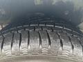 Close-up of a tire from a 2019 Ford Transit Connect showcasing deep tread patterns for improved traction