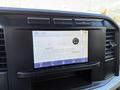 Dashboard display of a 2024 Ford F-550 showing a touchscreen interface with options for audio settings and phone connectivity
