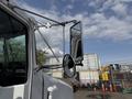 A 1996 Kenworth T800 truck with a large side mirror and a prominent front view of the cabin and windshield