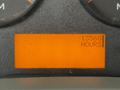 A digital display showing 13568 HOURS on a vehicle's dashboard