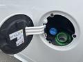 Close-up of the fuel filler cap on a 2016 RAM 1500 showing a blue nozzle and a green ring labeled diesel only