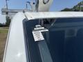 A 2019 Ford Transit 350 with a sticker on the windshield displaying a certificate of approval and a calendar for the months of January to July