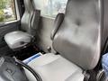 Interior of a 2013 International Workstar 7500 featuring two gray leather seats designed for commercial use