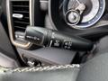A close-up of a windshield wiper control lever showing various settings including mist front and rear wipers