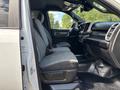 Interior view of a 2021 RAM 5500 showing the front seats and dashboard with gray fabric upholstery and modern controls