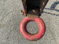 A close-up view of a red tow ring on a 2010 Vermeer Corporation BC1200XL with visible wear and rust on the metal surface