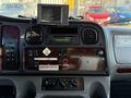 The interior dashboard of a 2011 Freightliner M2 106 featuring controls gauges a radio and a small monitor