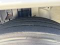 Close-up of a tire from a 2020 Hino 338 showcasing the tread pattern and sidewall details