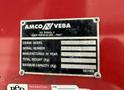 A metal identification plate attached to a red surface displaying information about an AMCO VEBA crane model M906 RS including serial number and manufacturing year
