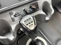 Close-up of a gear shifter in a 2016 Freightliner 108SD with a numeric layout showing various gear options and an Eaton logo
