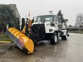 A 2016 Freightliner 108SD snow plow truck with a yellow blade attached at the front