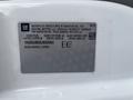 A 2020 Chevrolet Express van displaying a vehicle identification number and manufacturing details on a label