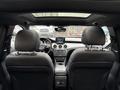 Interior view of a 2016 Mercedes-Benz GLA-250 showcasing black leather seats dashboard and central display with infotainment system