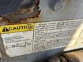 A caution label with instructions for towing pushing or winching a 2010 Skyjack SJ highlighting safety precautions and operational guidelines