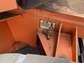A 2009 JLG E300AJP with an orange frame showing a weight capacity label indicating maximum capacity of 8500 lbs or 3860 kg