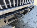 A close-up of a 2008 International 7500 truck's front bumper featuring a circular tow hook and a sturdy black frame design