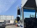 A 2011 Workhorse W62 truck with a side view mirror and dashboard controls visible in the foreground