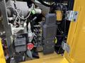 Close-up view of the internal components of a 2022 Caterpillar 306 excavator featuring hydraulic controls and electrical systems