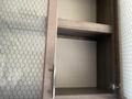 Empty shelf space inside a cabinet of a 2021 Grand Design Recreational ST3478MBS with a textured backing