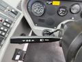 The image shows the control panel of a 2012 Global M4 with various gauges and a lever labeled pull for tele and a switch with buttons for different functions