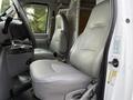 The image shows the interior of a 2008 Ford Econoline featuring two gray leather seats with a dashboard and center console visible in the foreground