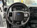 Steering wheel of a 2016 Ford F-550 Super Duty with controls and gauges visible on the dashboard