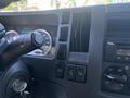 Interior dashboard of a 2022 Isuzu NQR featuring speedometer gauges various control buttons and an air vent