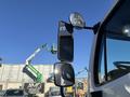 A 2005 Freightliner M2 106 truck with side mirrors prominently displayed in the foreground